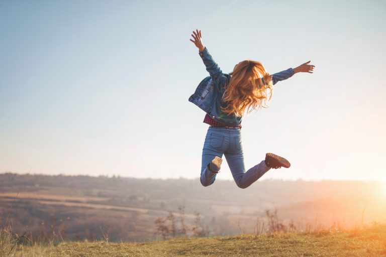 Happy jump by girl in nature
